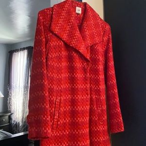 Cabi 3/4 length coat in vibrant reds and orange.